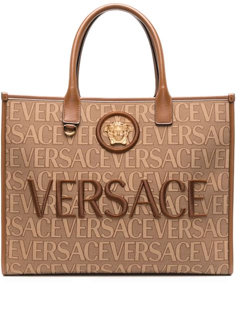 versace handbags with big zipper.